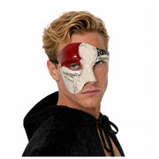 Blonde male model wearing an asymmetrical Venetian masquerade mask with formal masquerade attire