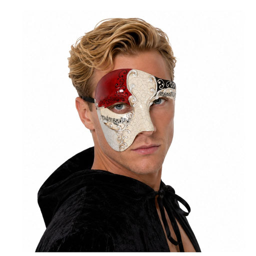 Blonde male model wearing an asymmetrical Venetian masquerade mask with formal masquerade attire