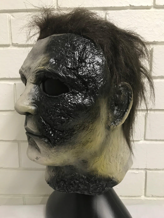 Michael Myers Burnt Face Latex Mask - The Costume Company